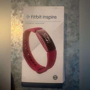 Fitbit Inspire Brand New in Box in color Sangria in box.